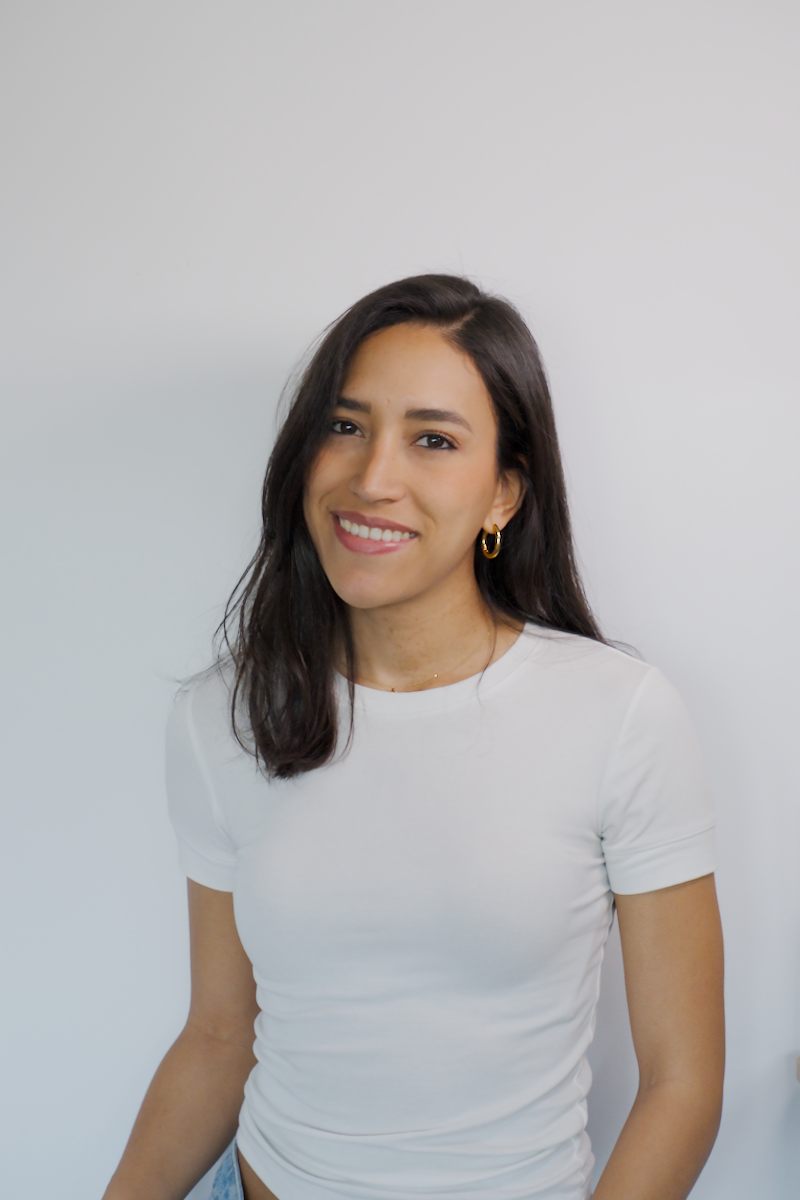 Elegant minimalist portrait of a woman holding a ceramic bowl